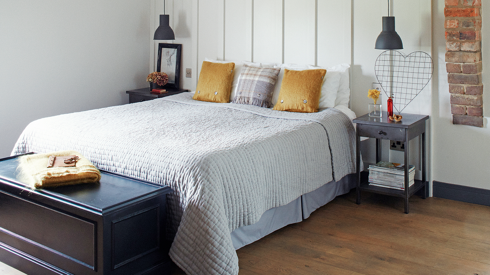 pale grey bedroom with mohair mustard cushions and throw added for autumn cosiness
