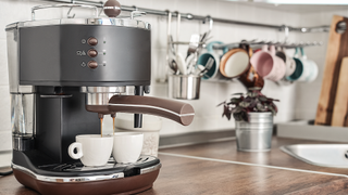 Kitchen with coffee machine and mugs