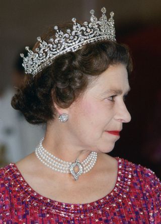 Queen Elizabeth II wears a four strand diamond and pearl choker with 'Granny's Tiara' to an engagement in Bangladesh.