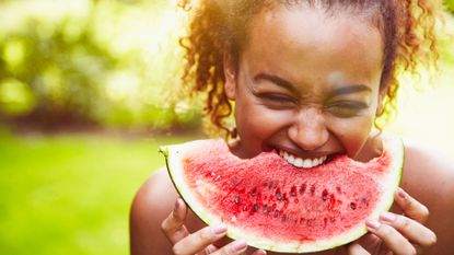 Person eating melon