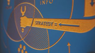 close-up of wall board stating strategy