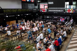 England fans at tables in Boxpark Wembley on July 07, 2021 in London, England. England has reached the semi-finals of the UEFA European Football Championship 2020 hoping to make the final for the first time in the history of the competition.