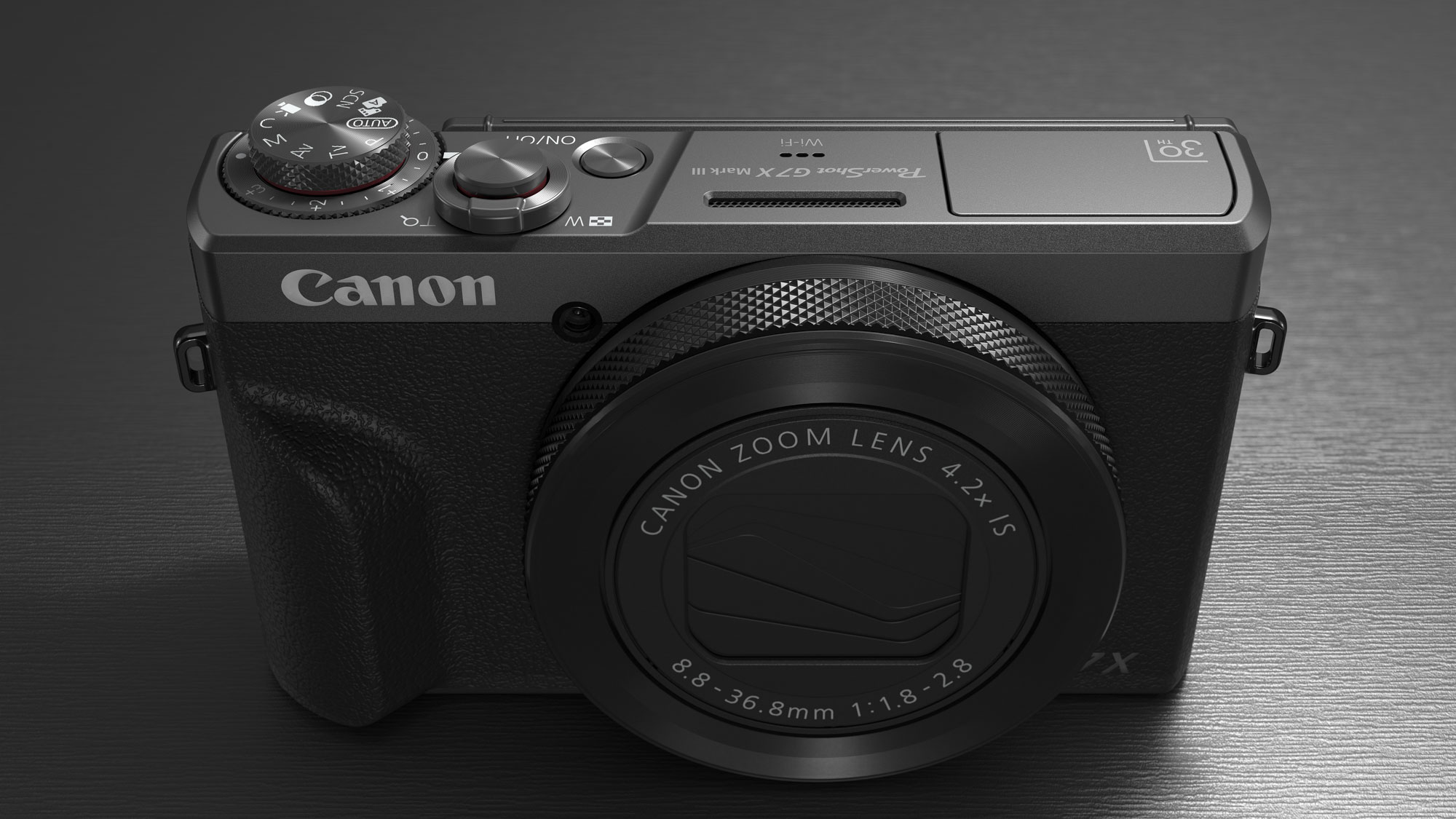 Canon PowerShot G7 X Mark III Anniversary Edition in graphite, on a graphite-type surface