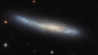 This NASA/ESA Hubble Space Telescope image shows NGC 4423, a galaxy that lies about 55 million light-years away in the constellation Virgo.