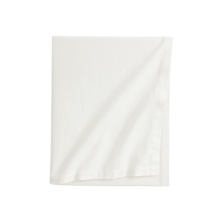 Folded white linen tablecloth