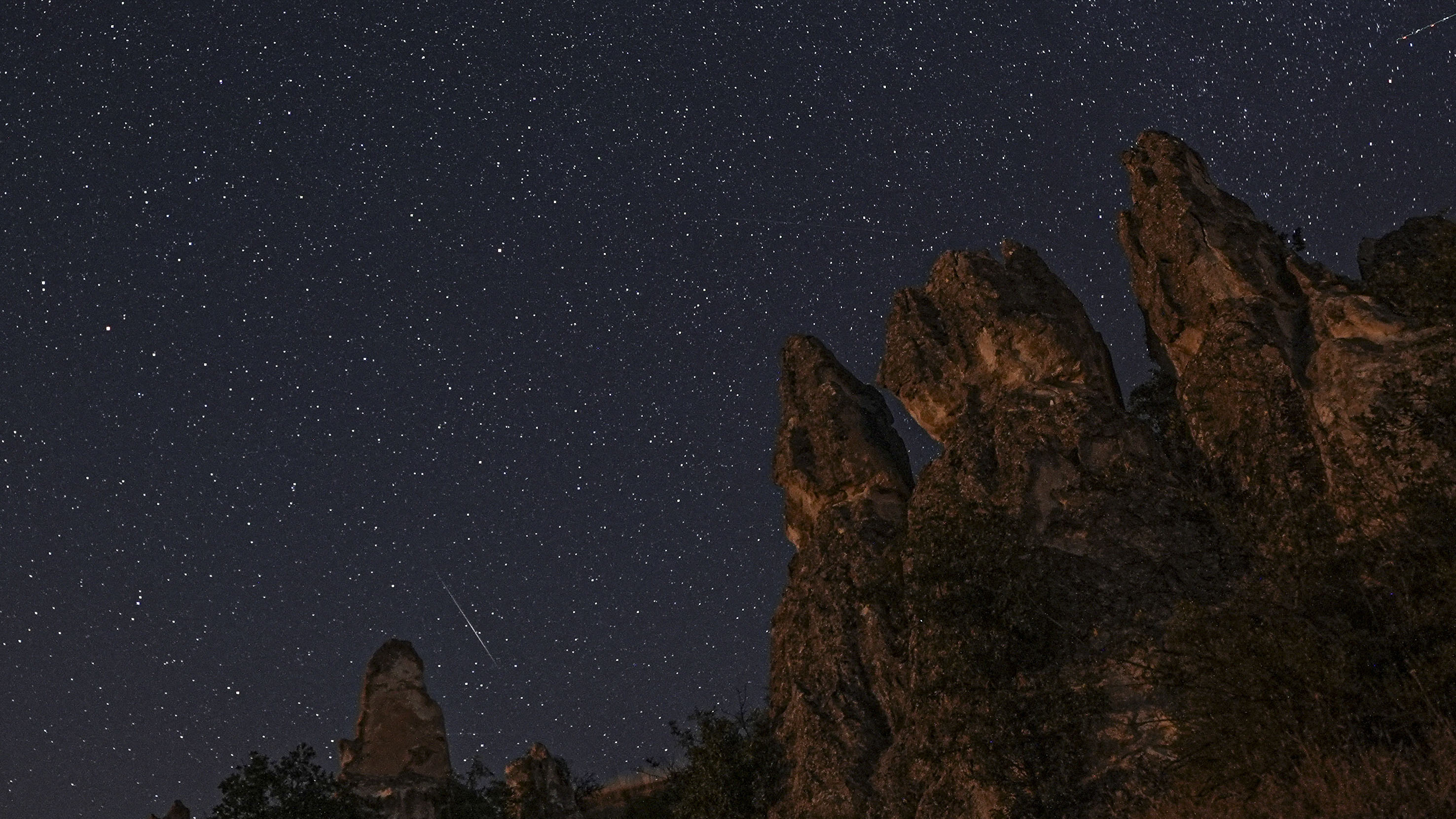 ANKARA, TURKIYE - AUGUST 13: Meteor shower is observed at Abaci Fairy Chimneys in Kizilcahamam district of Ankara, Turkiye on August 13, 2026. (Photo by Metin Aktas/Anadolu via Getty Images)