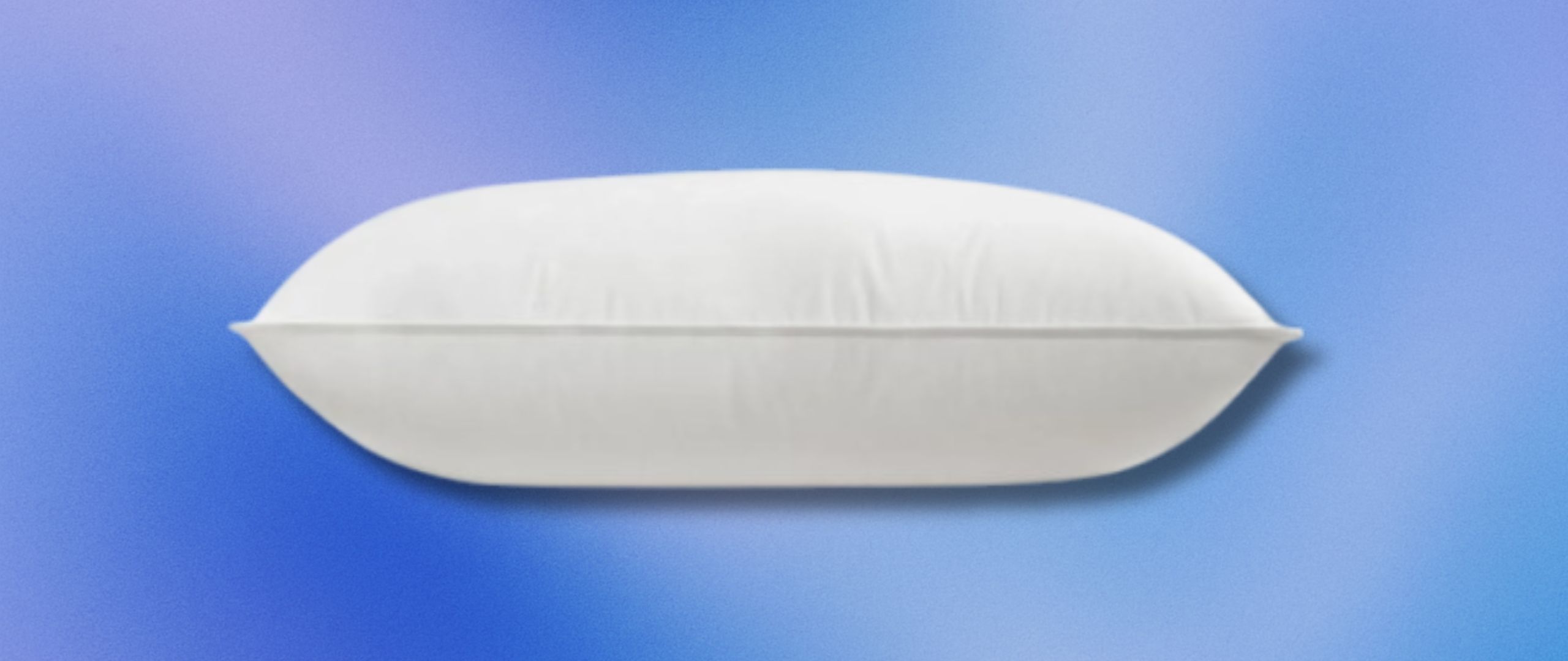 A Helix Down &amp; Feather Pillow on a gray gradient background. 