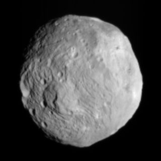 NASA's Dawn spacecraft snapped this photo of the huge asteroid Vesta on July 9, 2011. It was taken from a distance of about 26,000 miles (41,000 kilometers) away from Vesta. Each pixel in the image corresponds to roughly 2.4 miles (3.8 km).