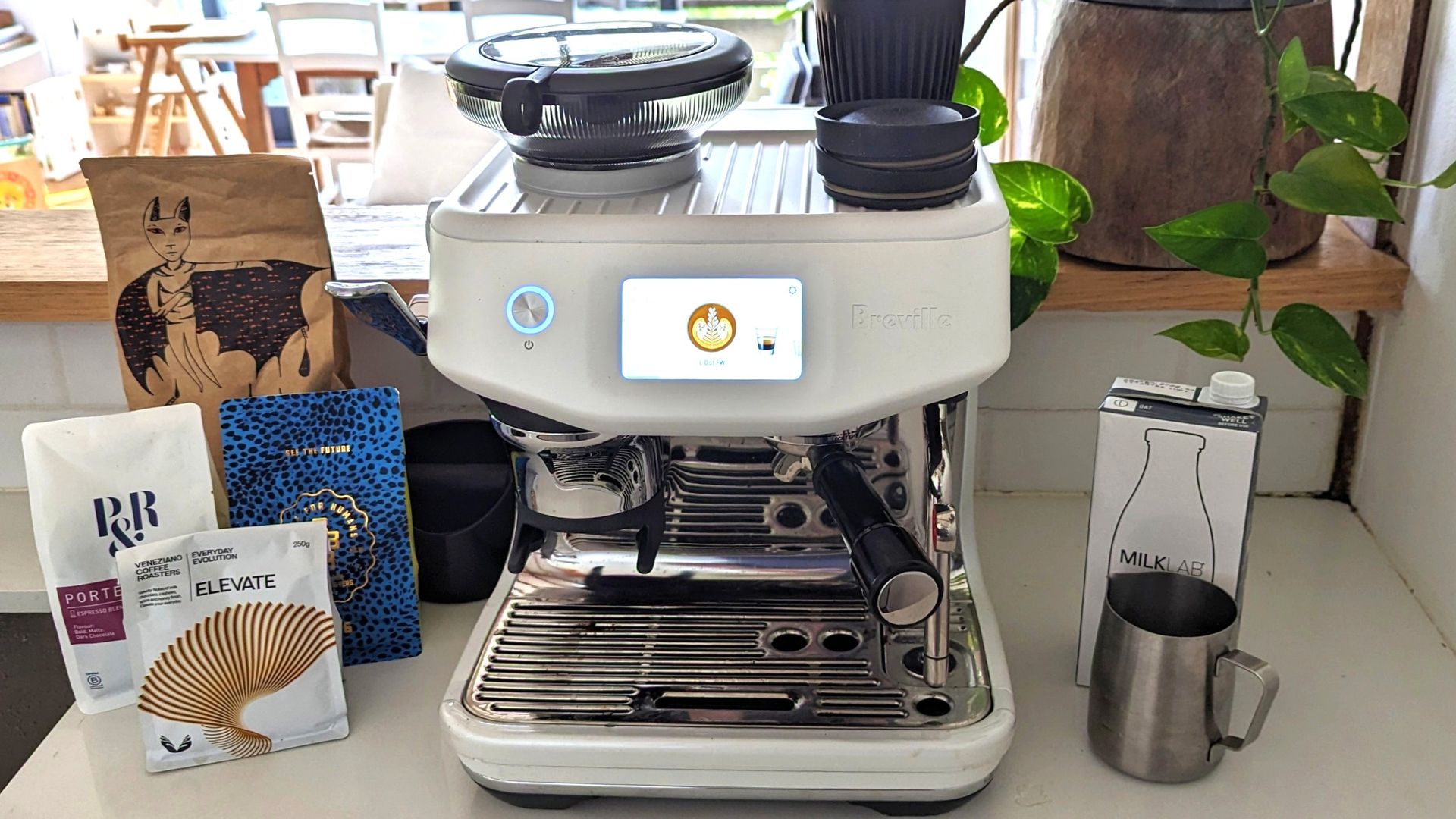 Breville Barista Touch Impress coffee maker on kitchen counter
