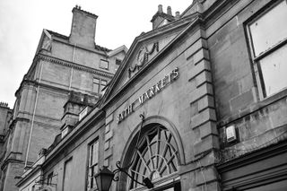 Sign outside Bath Markets in black and white