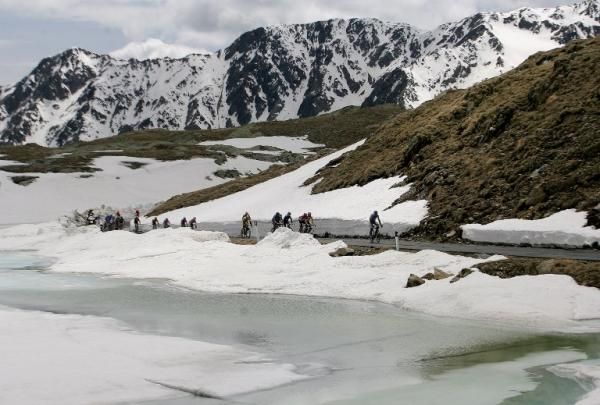 While racing in the high mountains at the Giro, passes are frequently still lined with snow.