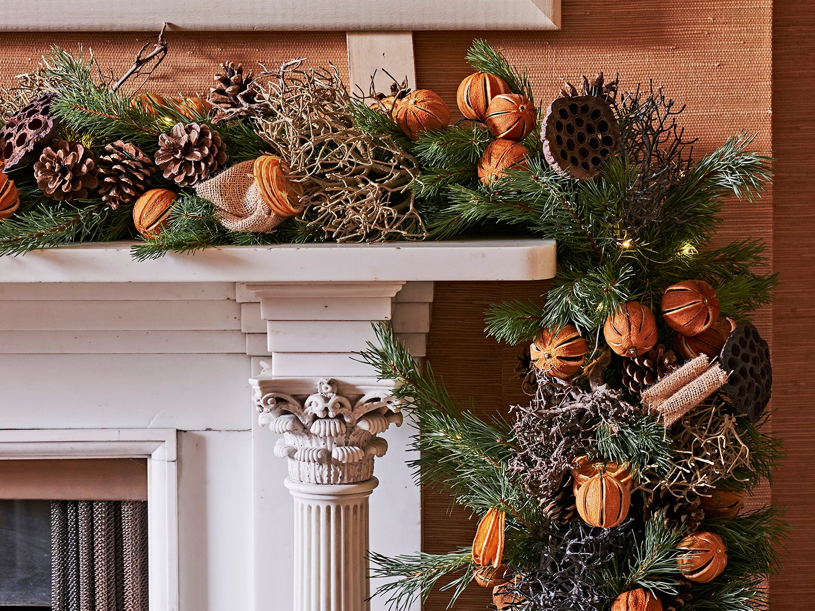 Fireplace Christmas garland with pinecones and dried citrus fruit