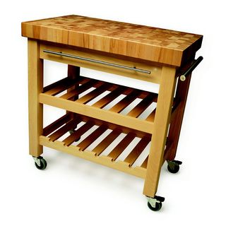 A wooden butchers block on casters with two open shelves