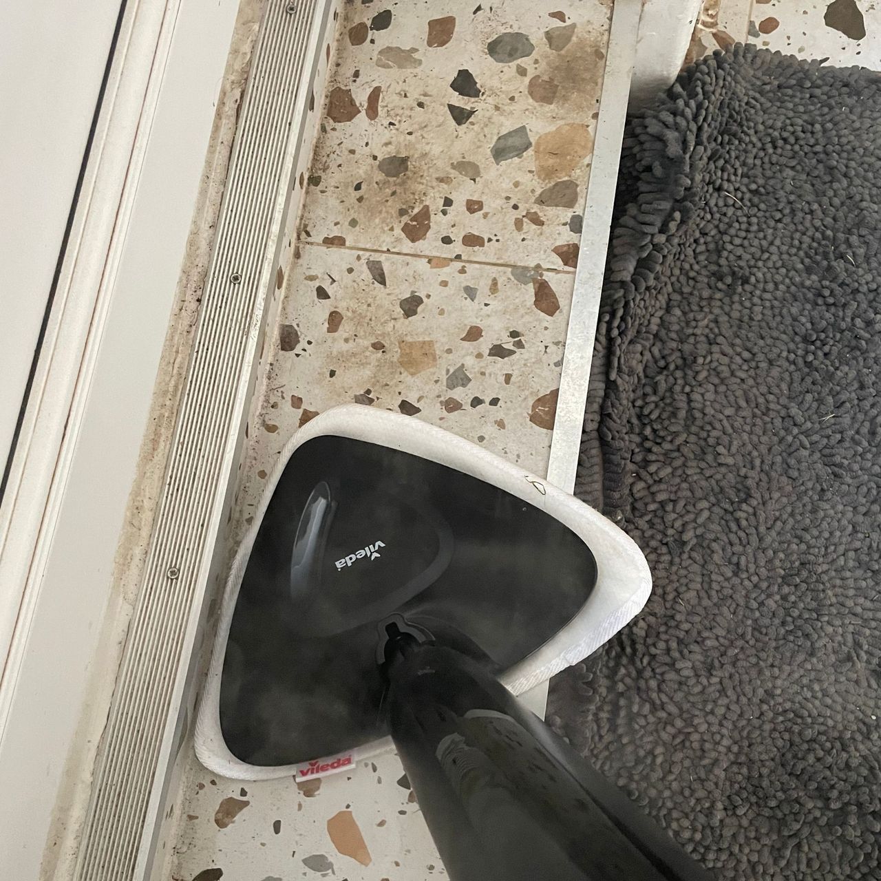 Using the Vileda Steam Mop Plus on a terrazzo tiled kitchen step