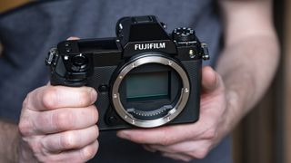 Fujifilm GFX100S II camera in the hand no lens attached