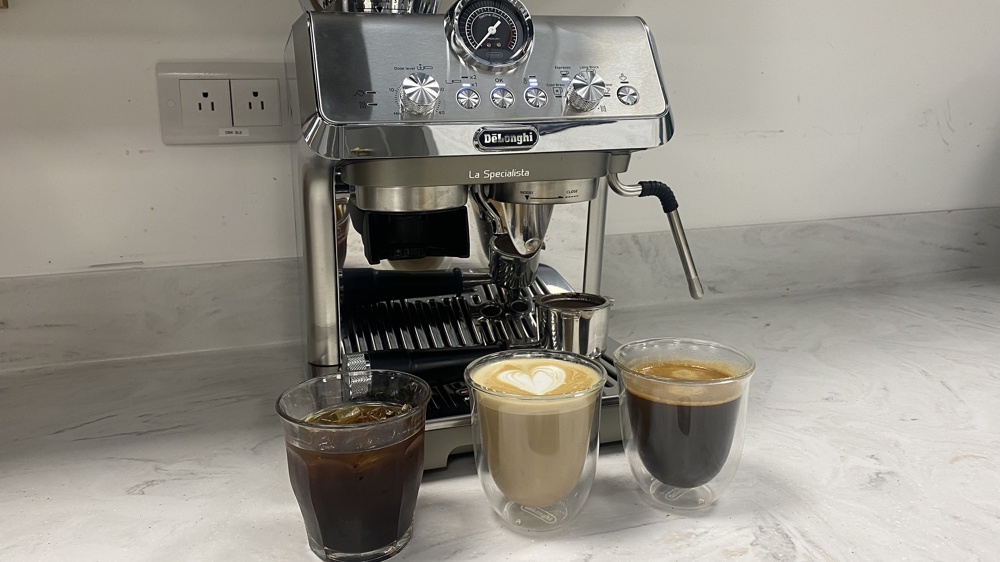 Testing a stainless steel De'Longhi coffee machine at the test centre