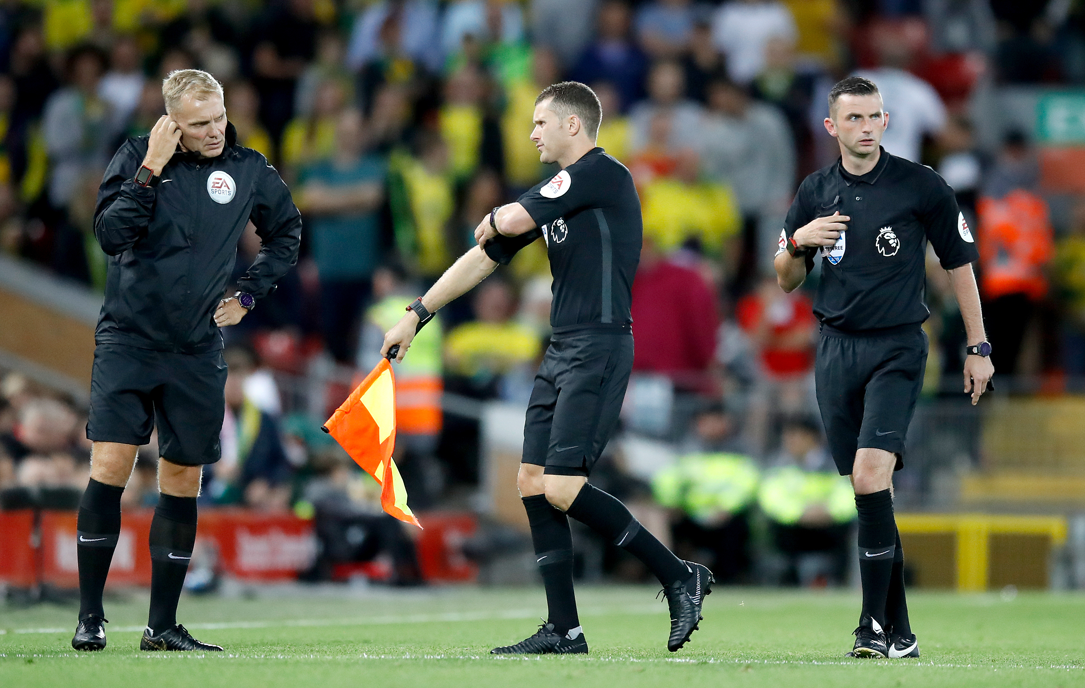 Simon Bennett, centre, comes to the sideline for running repairs