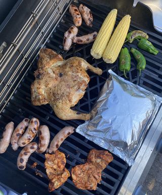 cooking chicken, vegetables and sausages on a Weber gas BBQ