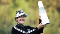 Hannah Green holds up the 2024 BMW Ladies Championship trophy