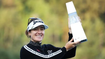 Hannah Green holds up the 2024 BMW Ladies Championship trophy