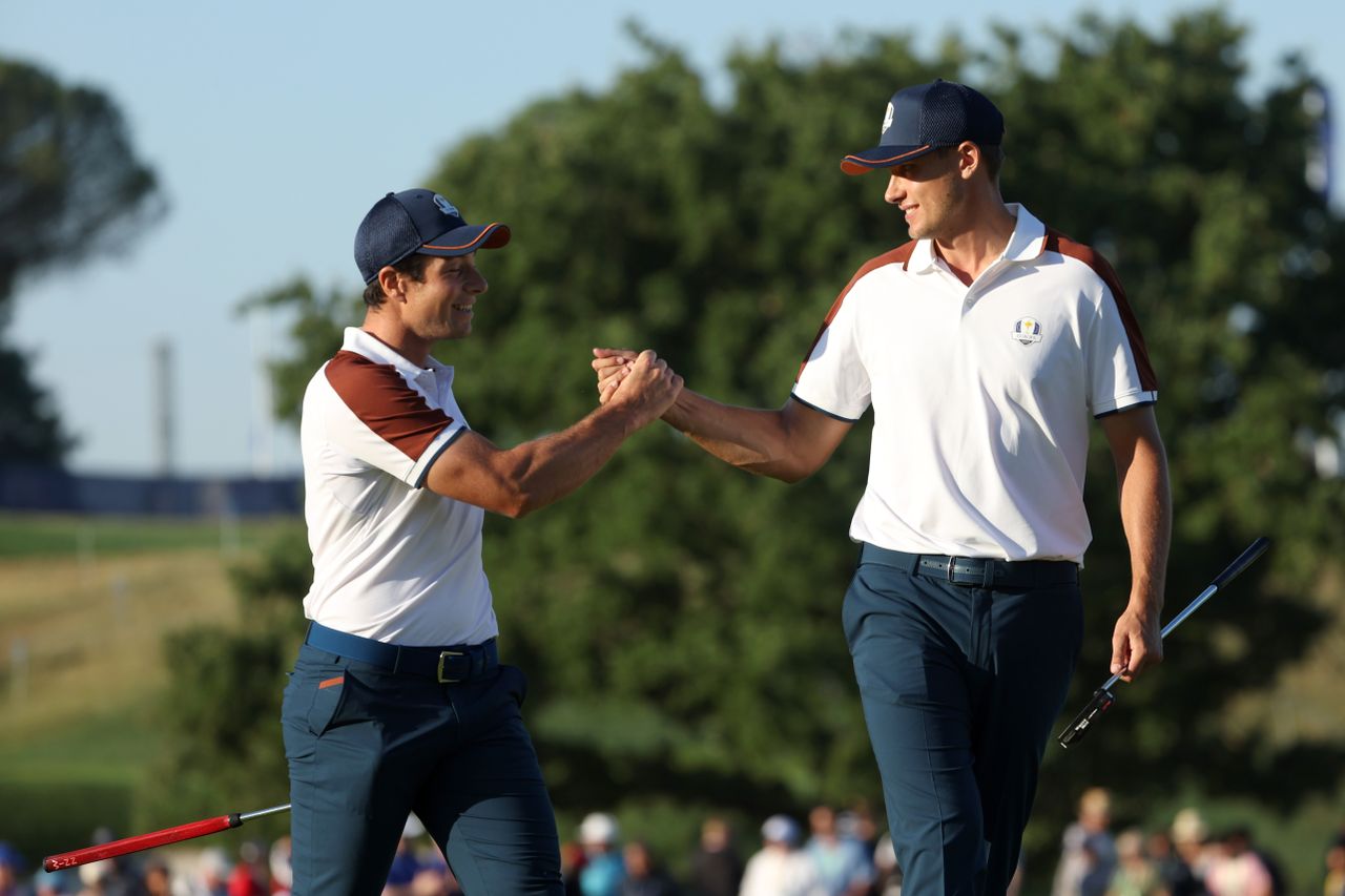 Ludvig Aberg and Viktor Hovland of Team Europe celebrate on the third green during the Saturday morning foursomes matches of the 2023 Ryder Cup 