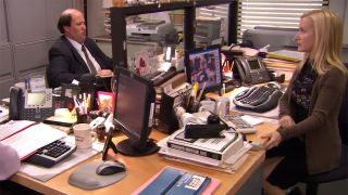 Angela and Kevin at their desks during The Office Cat scene.