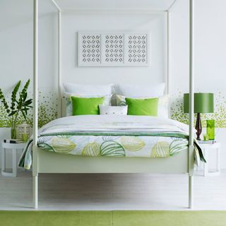 bedroom with white wall and pillows