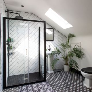 shower room with black frame shower enclosure black and white floor tiled