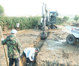 builders digging trenches for foundations