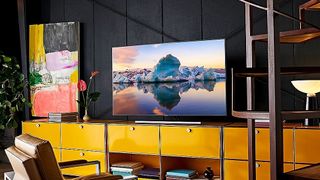 The Samsung Q85 QLED TV displayed in a home theater setup