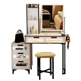 The Jahsun Makeup Vanity from Wayfair with a side storage table, stool, large mirror, and beauty products and a pocketbook on top
