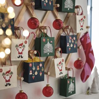 ikea alternative christmas tree with gift bags and ornaments