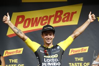 Primoz Roglic on the Tour de France podium after winning stage 19