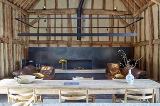 converted barn with modern interior design and black steel fireplace