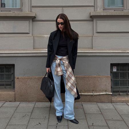 @annabelrosendahl outfit photo black blazer with blue jeans and plaid shirt around waist