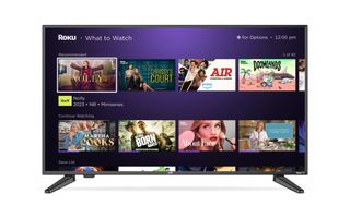 Roku TV on white background with What to Watch menu on screen
