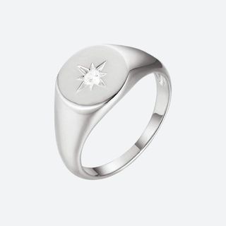 flat lay image of silver ring