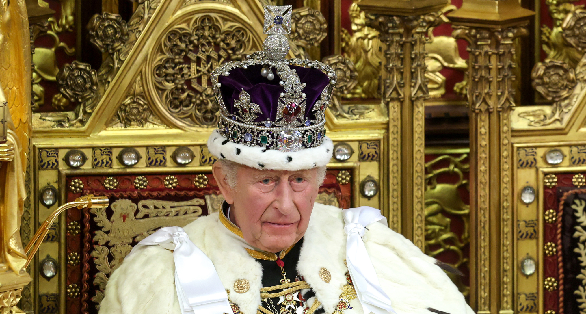 King Charles wearing a crown and robes
