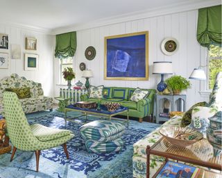 living room with blue and green color scheme and white walls