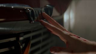 Arnie reaches for Christine in John Carpenter's Christine