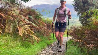 Woman trail running using Silva Carbon trail running poles