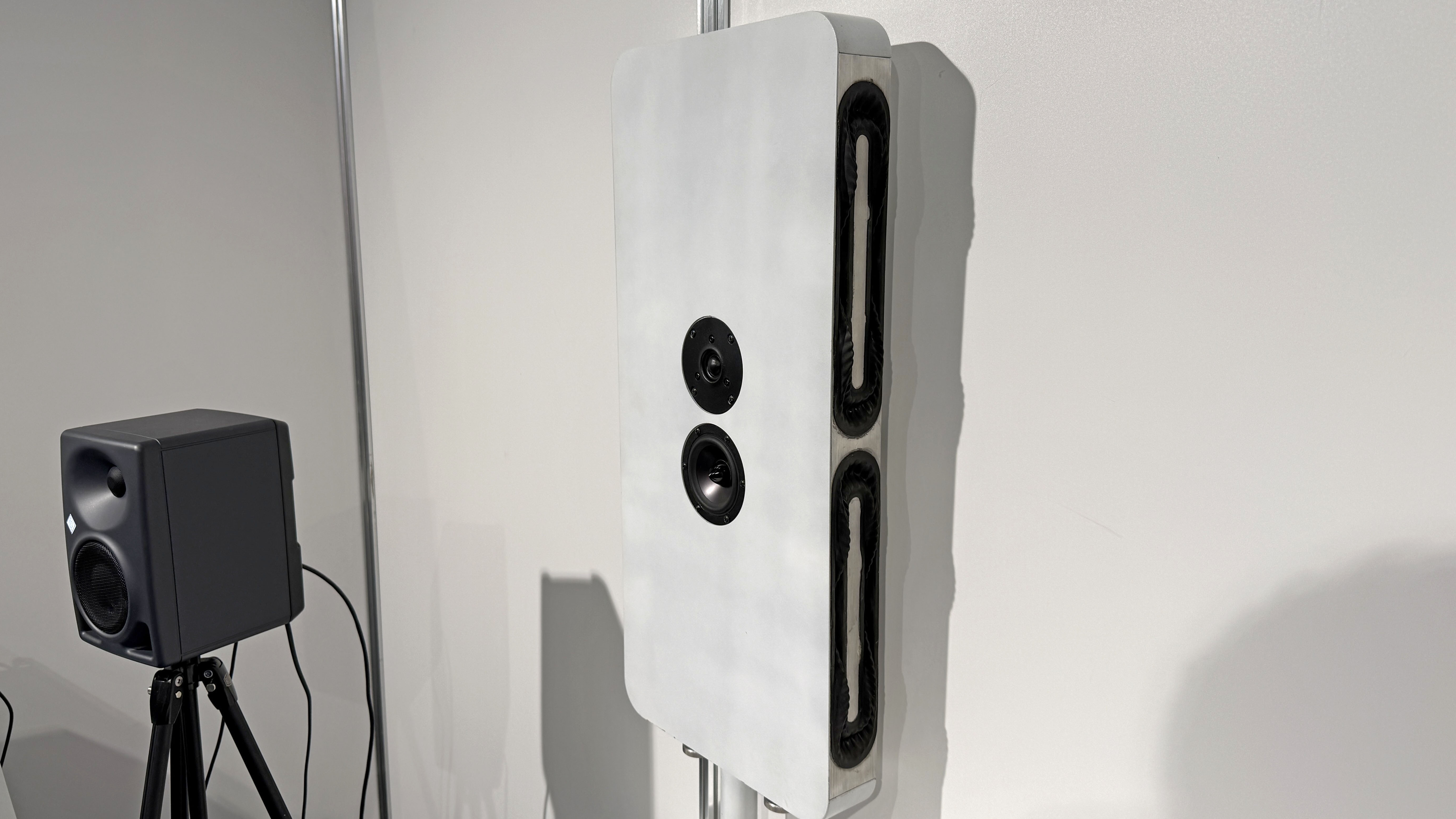 A wall-mounted speaker prototype using four GSS Model 1 transducers in the sides, and a two-way driver facing forwards