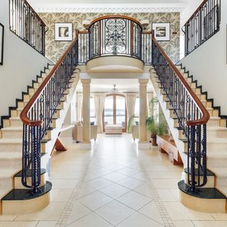 double cascading staircase with printed walls