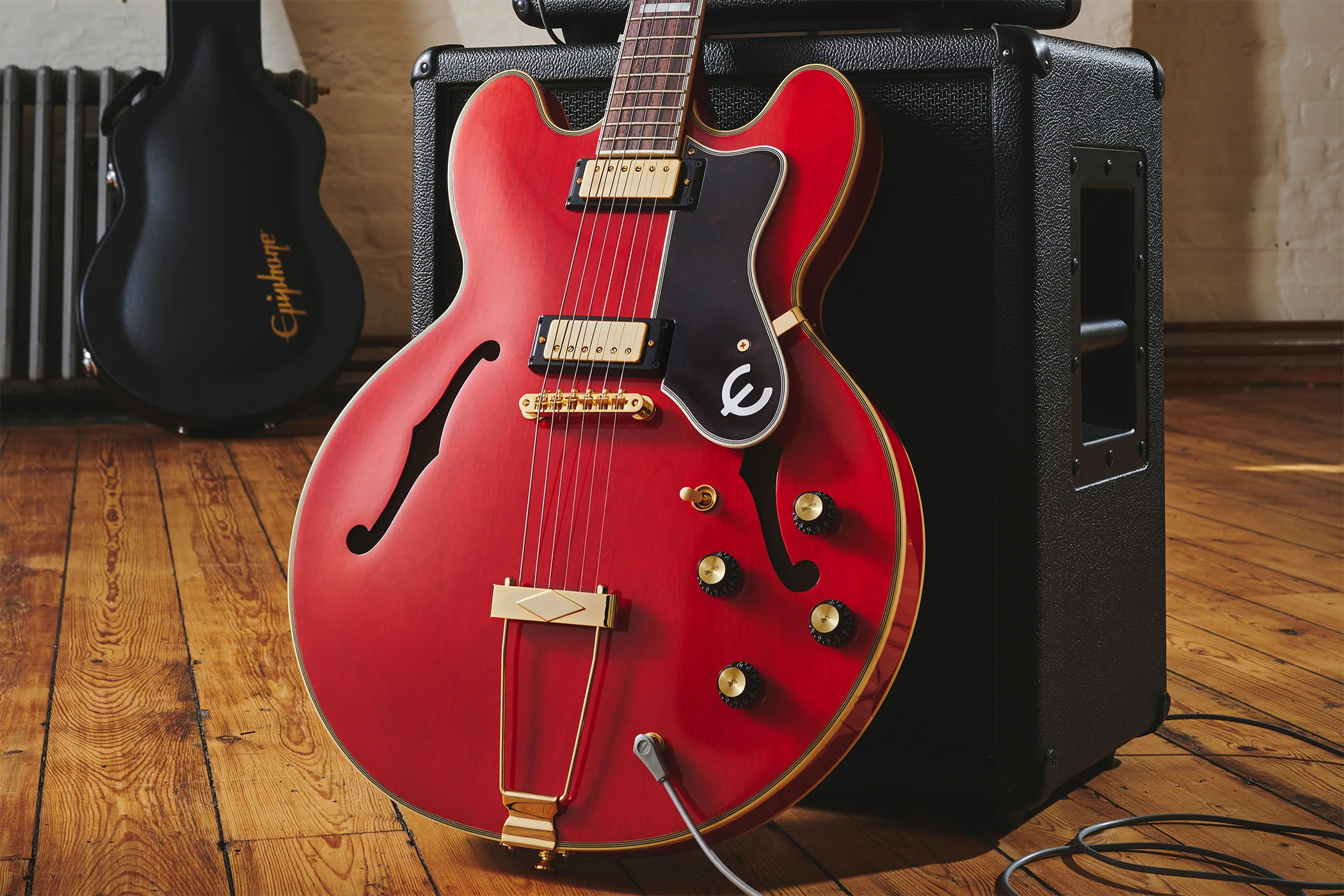 Epiphone Masterbilt Gem Archer Sheraton: this cherry red doozie honours the Oasis guitarist with a top-line build featuring Gibson USA mini-humbuckers.