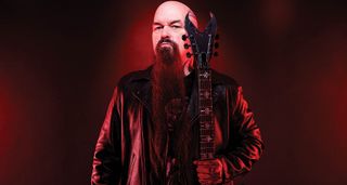 Kerry King lit up in red with his signature Dean Overlord