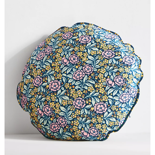 round velvet pillow with colorful floral pattern