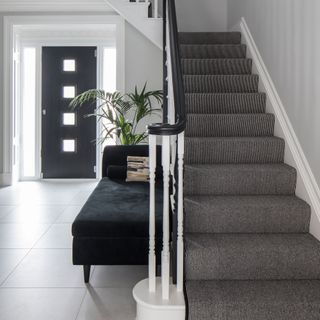 hallway stairs balustrade grey neutral front door