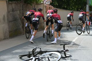 Michal Kwiatkowski and Gianni Moscon give Geraint Thomas a push