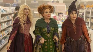 (L-R) Sarah Sanderson (Sarah Jessica Parker), Winifred Sanderson (Bette Midler) and Mary Sanderson (Kathy Najimy) in costume as the witch sisters from Hocus Pocus 2.