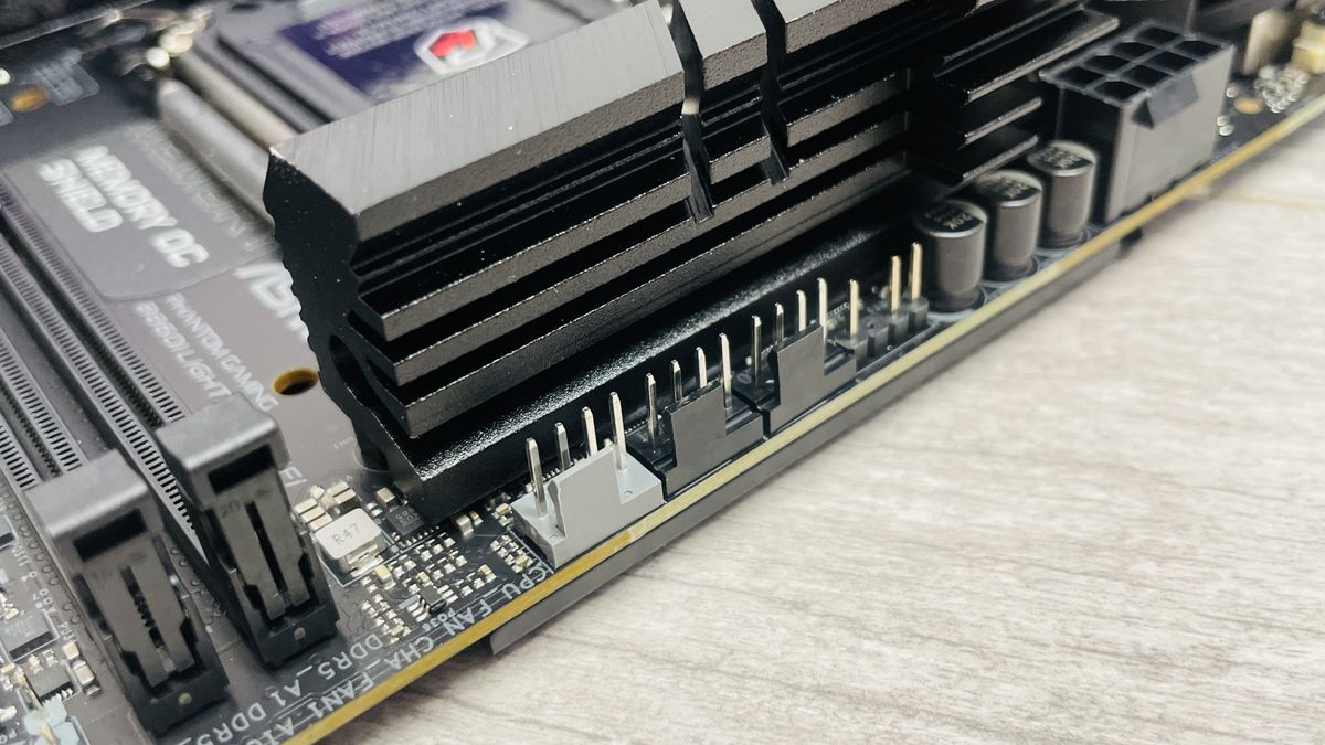 ASRock Phantom Gaming B860I Lightning Wi-Fi motherboard on a desk.
